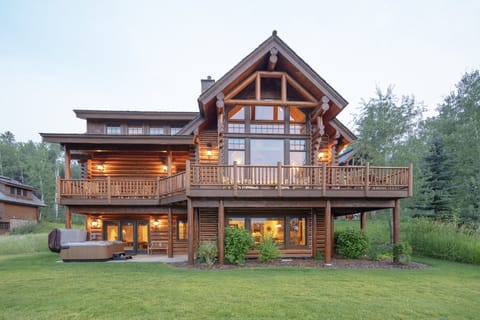 Your stunning log cabin retreat awaits with warm wood beams and expansive windows that frame nature's beauty. Enjoy morning coffee on your private deck or unwind in the hot tub as evening lights create the perfect ambiance.