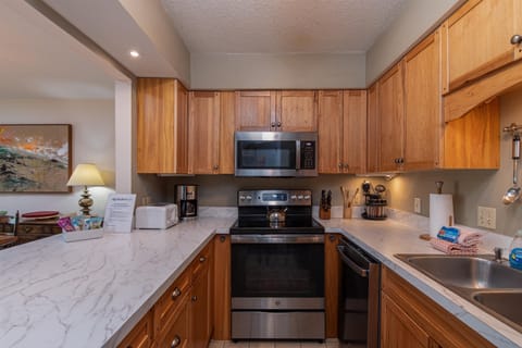 - Fully equipped kitchen with stainless steel appliances   - Wooden cabinets and spacious countertops for cooking   - Perfect setup for preparing meals during your stay