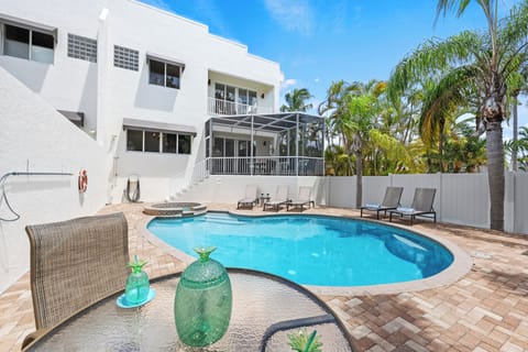 Stretch out under the Florida sun with comfortable loungers placed poolside for total serenity.