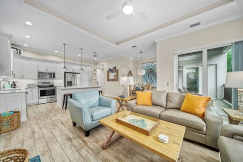 Show-it-all view: an open concept living space where the kitchen, dining, and living room blend seamlessly for together time.