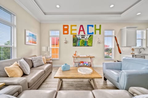 Plush seating, coastal-chic accents, and open flow make gathering effortless.