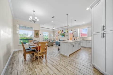 Bright, open-concept living—where cozy gatherings and breezy island vibes blend seamlessly.