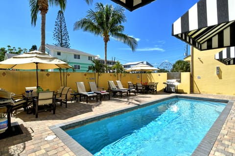 Dive into the semi-private heated pool—steps from your private cabana and perfect for sunny days or evening swims.