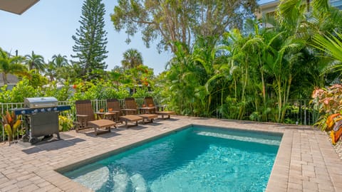 Slip into sun-drenched serenity—your one of two private pools! These tropical patios are the heartbeat of your Siesta Key escape.