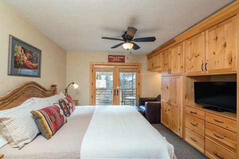 Viking Lodge 212 - the king master bedroom is super cozy and opens to a private balcony overlooking the river.