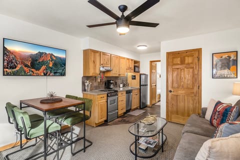 The living area offers a cozy lounge space with sleeper sofa for additional guests-with stunning views of San Miguel and the ski mountain, perfect for relaxing after a day outdoors