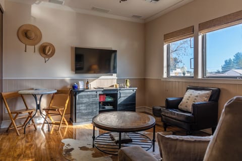 Gather for a movie on the leather chairs by the tv