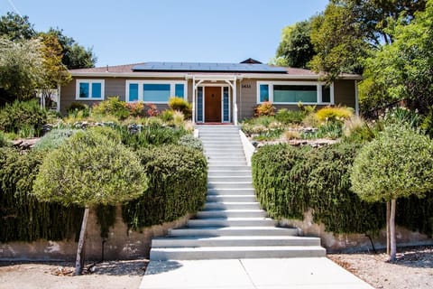 Landscaped steps lead to a calm, elevated arrival
