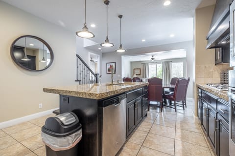 Kitchen - The kitchen is fully stocked with all the dishes, cookware, baking pans, and cutlery you will need for meal preparations and includes stainless steel appliances and granite counter tops.