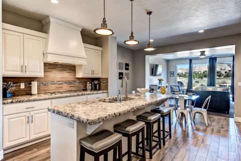 Kitchen Island View - The Kitchen Island comfortably seats 4 adults and creates a great space for serving and preparing meals.