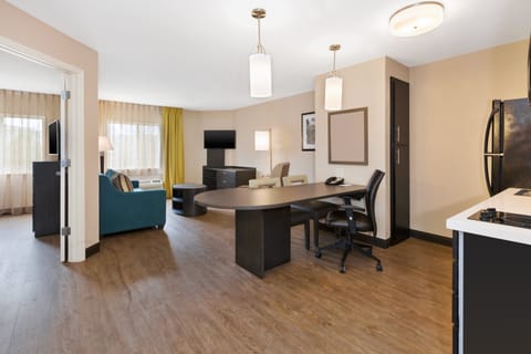Premium bedding, desk, laptop workspace, blackout drapes