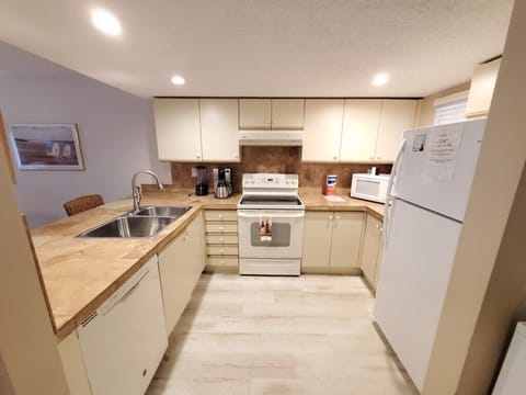 Fully equipped kitchen with modern appliances and ample counter space.