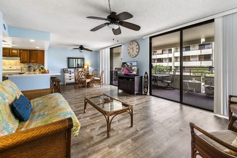 Living Area with Lanai Access, TV, Sofa, Accent Chairs, and Ceiling Fan