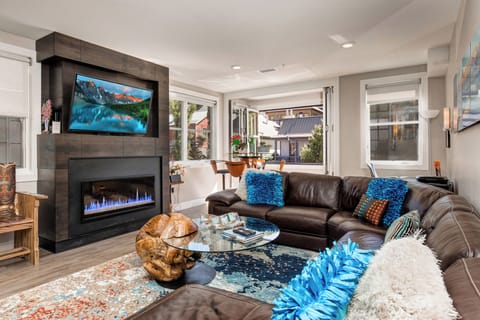 Chic living room large screen TV beautiful gas fireplace gorgeous views