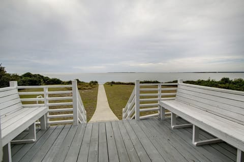 Open deck with beach path.