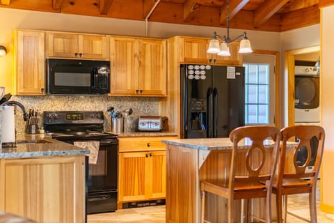 The kitchen has a full complement of tools and appliances.  The dining area has plenty of seating for all of your guests.