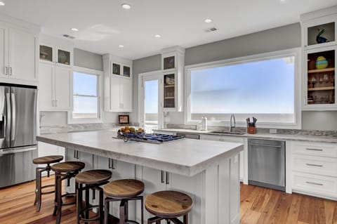 Newly updated kitchen with barstool seating.