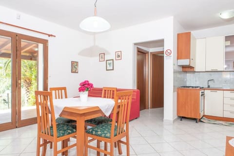 Furniture, Table, Property, Cabinetry, Plant, Flower, Wood, Chair, Orange, Lighting