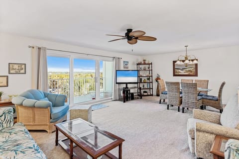 Relax in your spacious living room where tropical breezes flow through sliding doors to your private balcony with desert views.