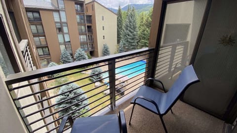 View from the balcony of the bedroom with 2 Queen beds to the pool.