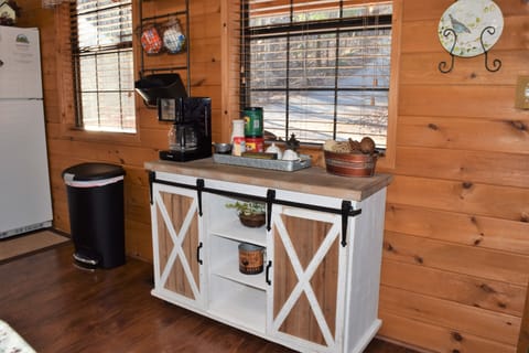 Kitchen coffee station overlooking the driveway to the cabin