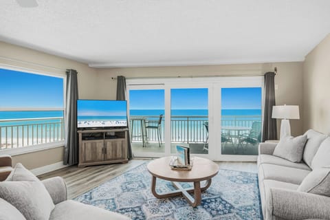Wake up to sweeping ocean and beach views right from your living room. Floor-to-ceiling windows and a private balcony invite the turquoise waters inside, creating your perfect beachfront retreat.