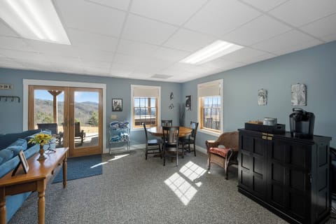 Your bright common area combines dining and relaxation with stunning mountain views streaming through oversized windows.