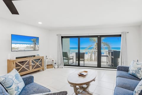 Relax in your bright living room with stunning ocean views through sliding glass doors to your private balcony.