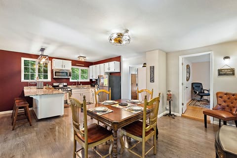 Have a meal and great conversation with the open kitchen and dining area.