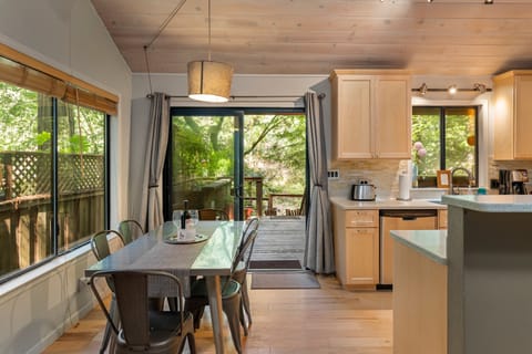 Dining area with redwood views and slider to the back deck