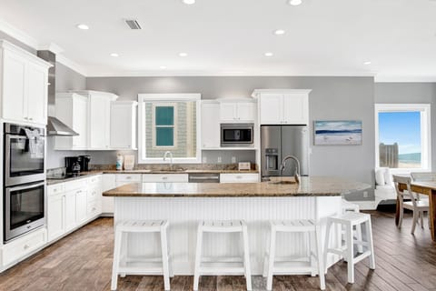 The kitchen is fully equipped and offers dual appliances