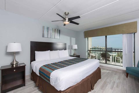 Our elegant primary bedroom has a king-size bed and a beautiful view!