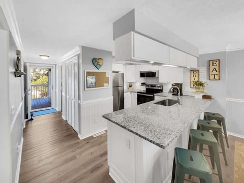 View Of Entry Hallway And Kitchen From Front Door