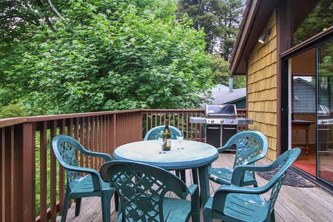 Outdoor dining and BBQ on the back deck overlooking the yard.
