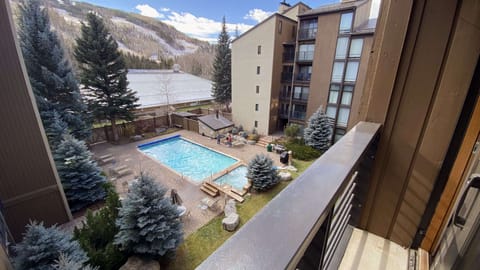 View to the pool from the bedroom with a King and Queen