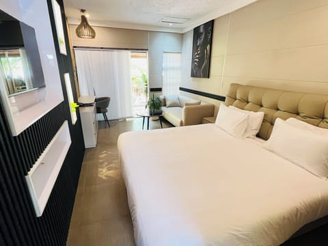 Standard Double Room | Living area | 42-inch LED TV with satellite channels, TV