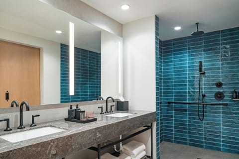 Suite, 1 Bedroom, Balcony | Bathroom | Shower, rainfall showerhead, free toiletries, hair dryer