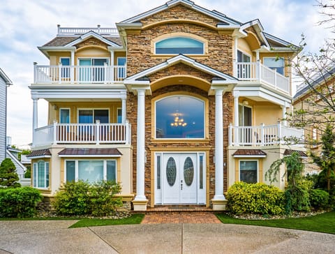 Front exterior with circular driveway.