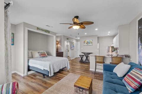 Your clever Murphy bed transforms this bright space from living room to bedroom in seconds, maximizing comfort in your coastal getaway.