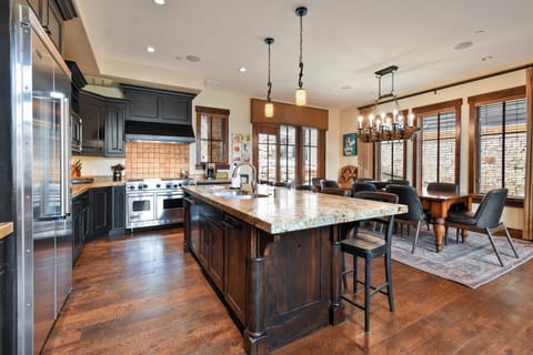 Your gourmet kitchen awaits with granite counters, stainless appliances, and island seating for memorable meals together.