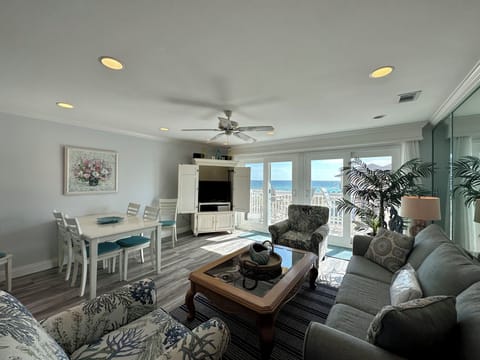 Unwind in your bright, coastal living space with ocean views, comfy seating, and a dining area perfect for memorable meals.