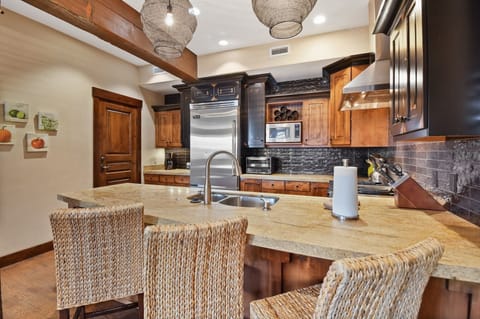 Your chef's dream awaits with granite counters, stainless appliances, and warm wood accents creating the perfect culinary retreat.