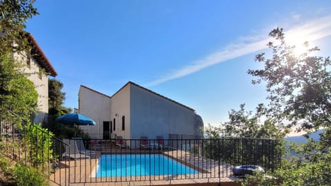 House and garage to the left seen from the end of the pool area