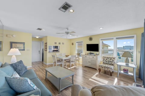 Settle into this sunlit open-concept living space where comfort meets convenience. With a cozy dining nook, updated amenities, and sweeping views from your private balcony, every moment here feels like home by the water.