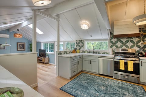 See wall of windows along the LR and kitchen. So much light!