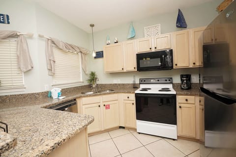 Your fully equipped kitchen features granite countertops, modern appliances, and everything you need to prepare memorable meals during your stay.