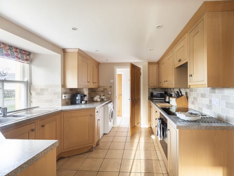 The Bothy at Swinton Hill -  the bright kitchen leading through to entrance hall