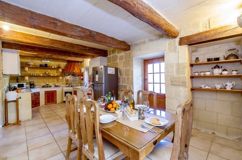 Kitchen and Dining area of Ponderosa traditional Malta farmhouse