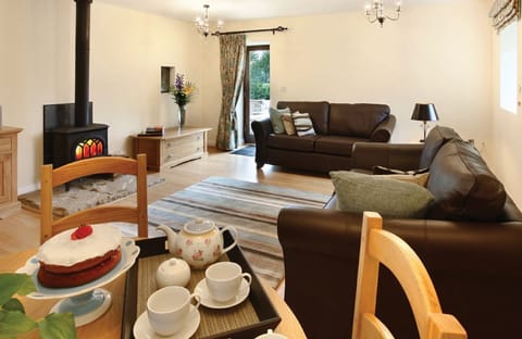 Ground floor: Large living room with single patio door and access to private patio and garden area