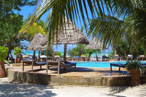 Outdoor pool, open 7 AM to 7 PM, pool umbrellas